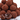 Chocolate truffles dusted with cocoa powder.