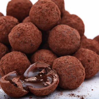 Chocolate truffles dusted with cocoa powder.