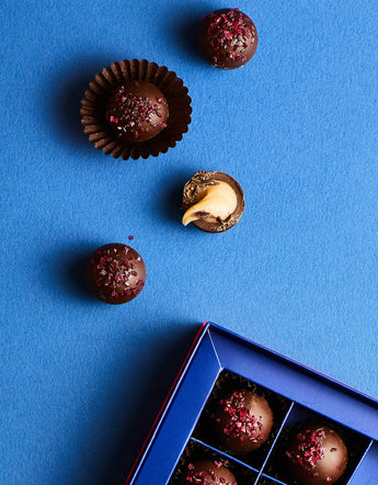 Chocolate truffles with raspberry sprinkles.