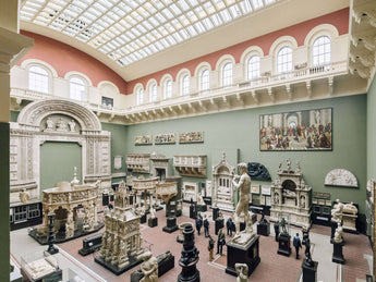 Museum hall filled with sculptures and artifacts.