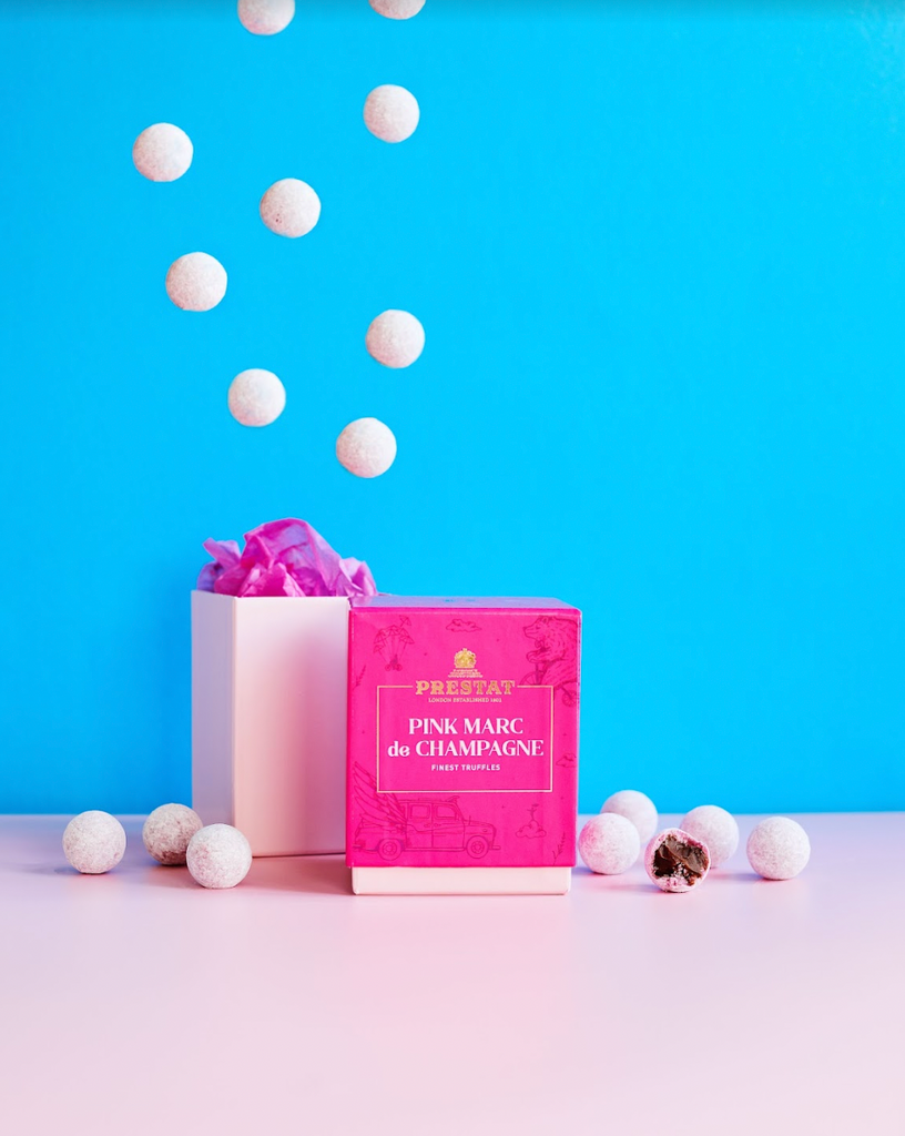 Prestat Chocolates London | Truffles fall from the sky, revealing a delicious pink marc de champagne ganache. 