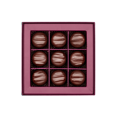 inside view of mint chocolate gift box with small assorted chocolates 