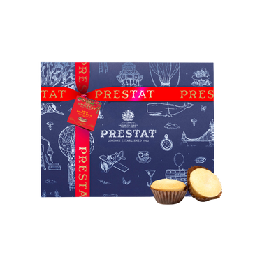 mini mince pies box with red ribbon and 'Prestat' branding, featuring illustrations on a white background.