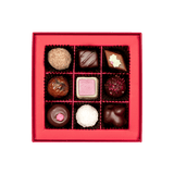 inside of small chocolate gift box with assorted truffles