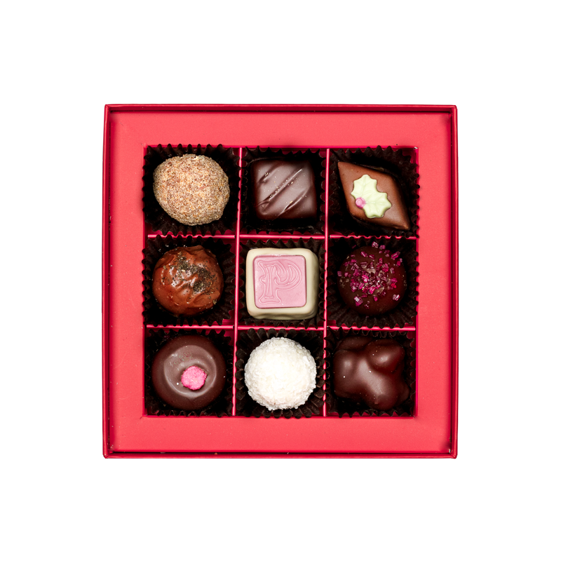 inside of small chocolate gift box with assorted truffles