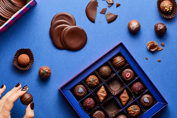 Assorted chocolates in a blue box.