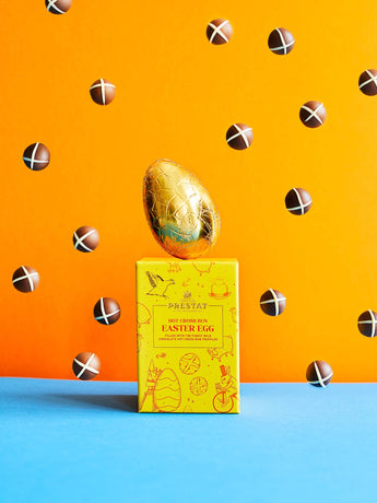 Easter egg atop a box.