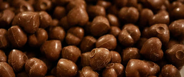 Pile of heart-shaped chocolates.