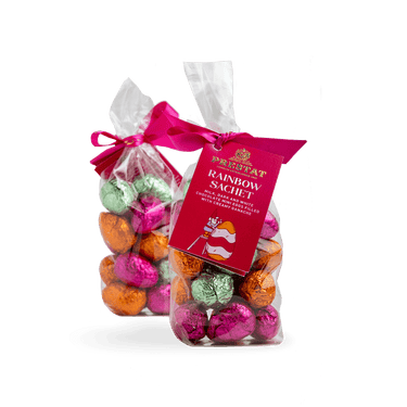 two bags colorful foil-wrapped chocolate By Prestat Chocolates